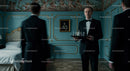 Elegant Waiter in a Luxurious Vintage Setting Serving Drinks