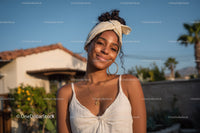 Young Woman Smiling Outdoors Wearing Summer Fashion Accessories
