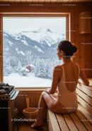 Woman Relaxing in Wooden Sauna with Snowy Mountain View