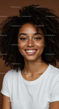 Portrait of a Smiling Young Woman with Curly Hair in Studio