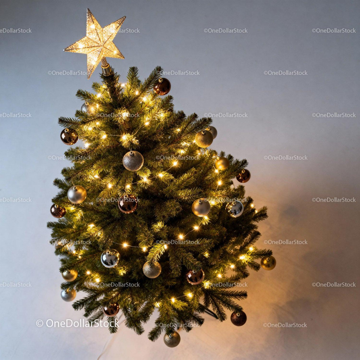 Decorated Christmas tree with glowing star topper