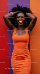 Vibrant Woman with Curly Hair in Orange Dress on Colorful Background