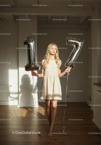 Young woman celebrating seventeenth birthday indoors