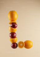 Letter L formed with fresh apples and oranges