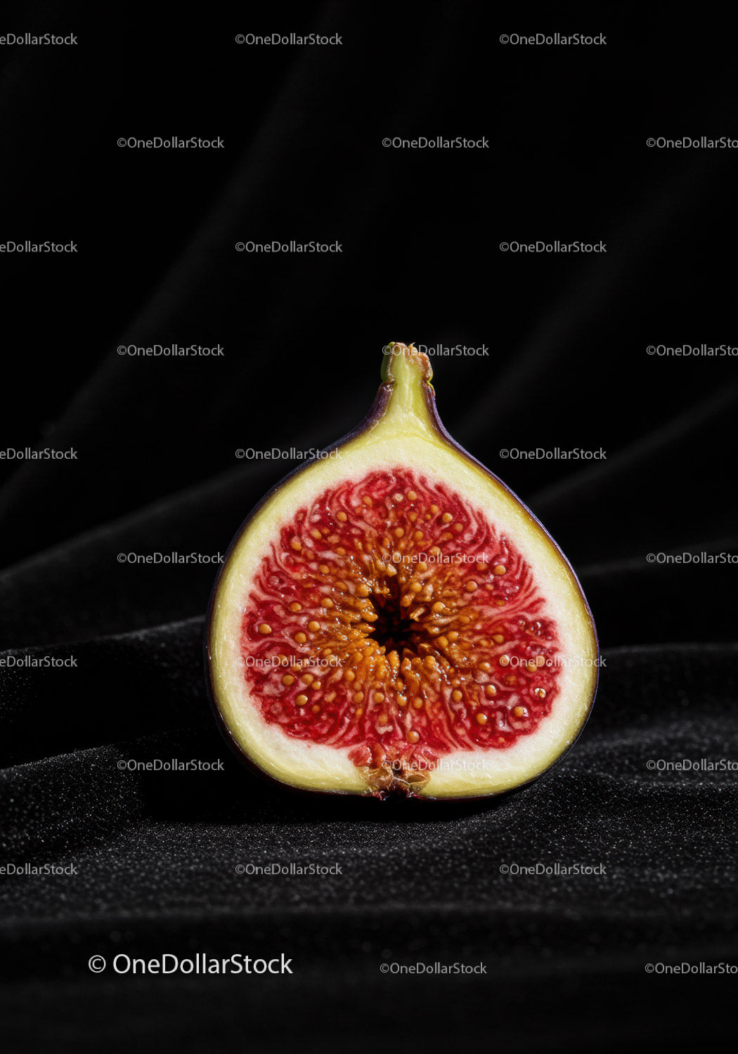 Close up of fresh ripe fig cut in half