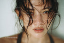 Close-up of Woman with Wet Hair and Intense Gaze