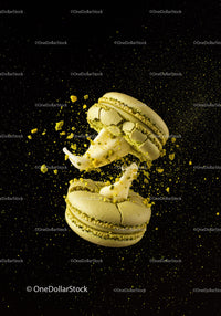 Green Macarons with Cream Filling Exploding on Black