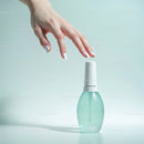 Elegant Hand Applying White Nail Polish with Modern Manicure