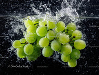 Fresh Green Grapes Splashing into Water with Dynamic Motion