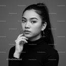 Elegant Black and White Portrait of a Young Woman with Hoop Earrings