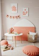 Stylish Nursery Decor with Coral Wall Art and Blush Pink Accents