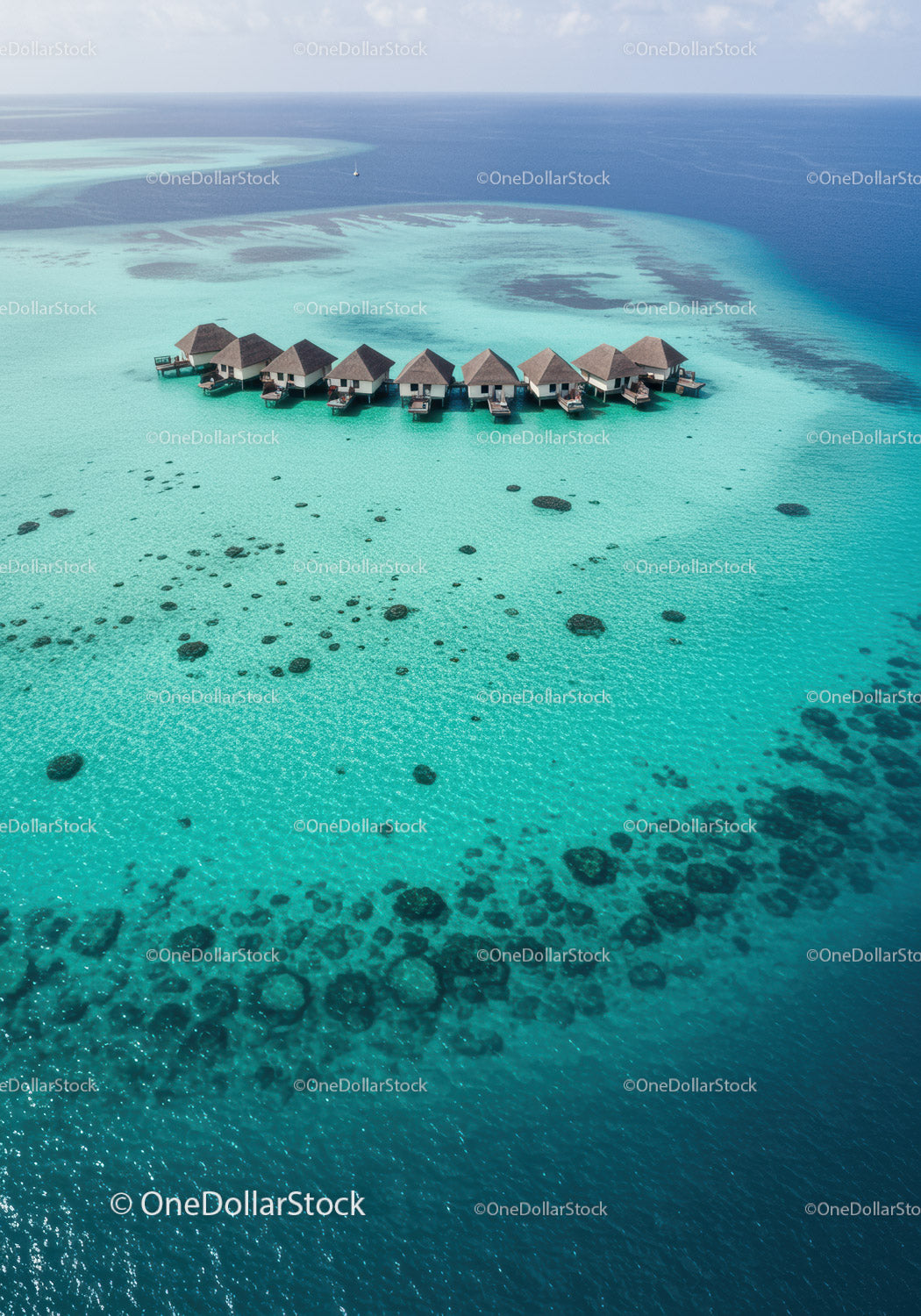 Overwater Bungalows on Turquoise Ocean with Clear Water and Exotic Scenery
