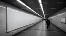 Minimalist Subway Tunnel with Tiled Walls and Modern Lighting