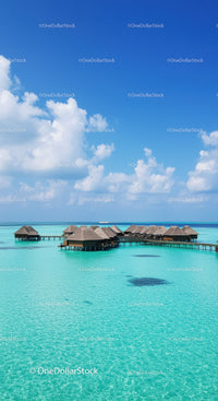 Overwater Bungalows in Turquoise Ocean Under Blue Sky with Clouds