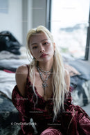 Glamorous Young Woman in Velvet Outfit with Jewelry in Modern Interior
