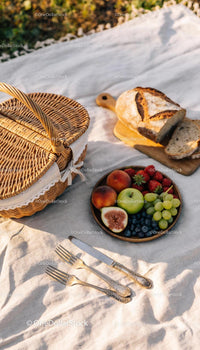 Rustic Outdoor Picnic with Fresh Fruit and Bread