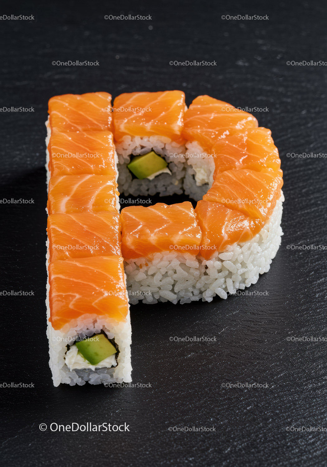 Sushi arranged in letter P with salmon topping