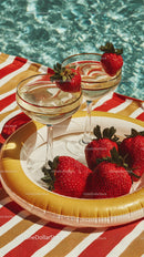 Strawberries and Refreshing Drinks by Poolside on a Bright Summer Day