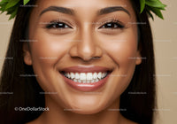 Close up of smiling woman with fresh green leaves