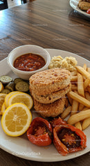 Crispy chicken nuggets with fries and fresh sides