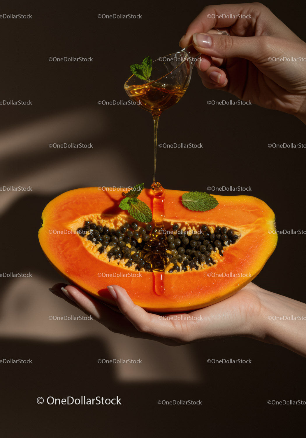 Honey drizzling over fresh ripe papaya slice