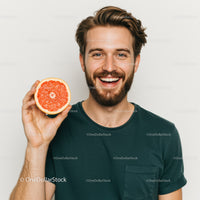 Cheerful Man with Bright Red Grapefruit Fresh Fruit in Hand
