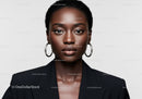 Elegant African American Woman in Black Blazer with Hoop Earrings