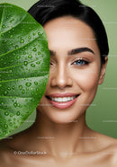 Vibrant Woman with Blue Eyes Surrounded by Green Tropical Leaves