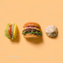 Gourmet Burger with Lettuce and Tomato Next to Grilled Steak and Dumpling