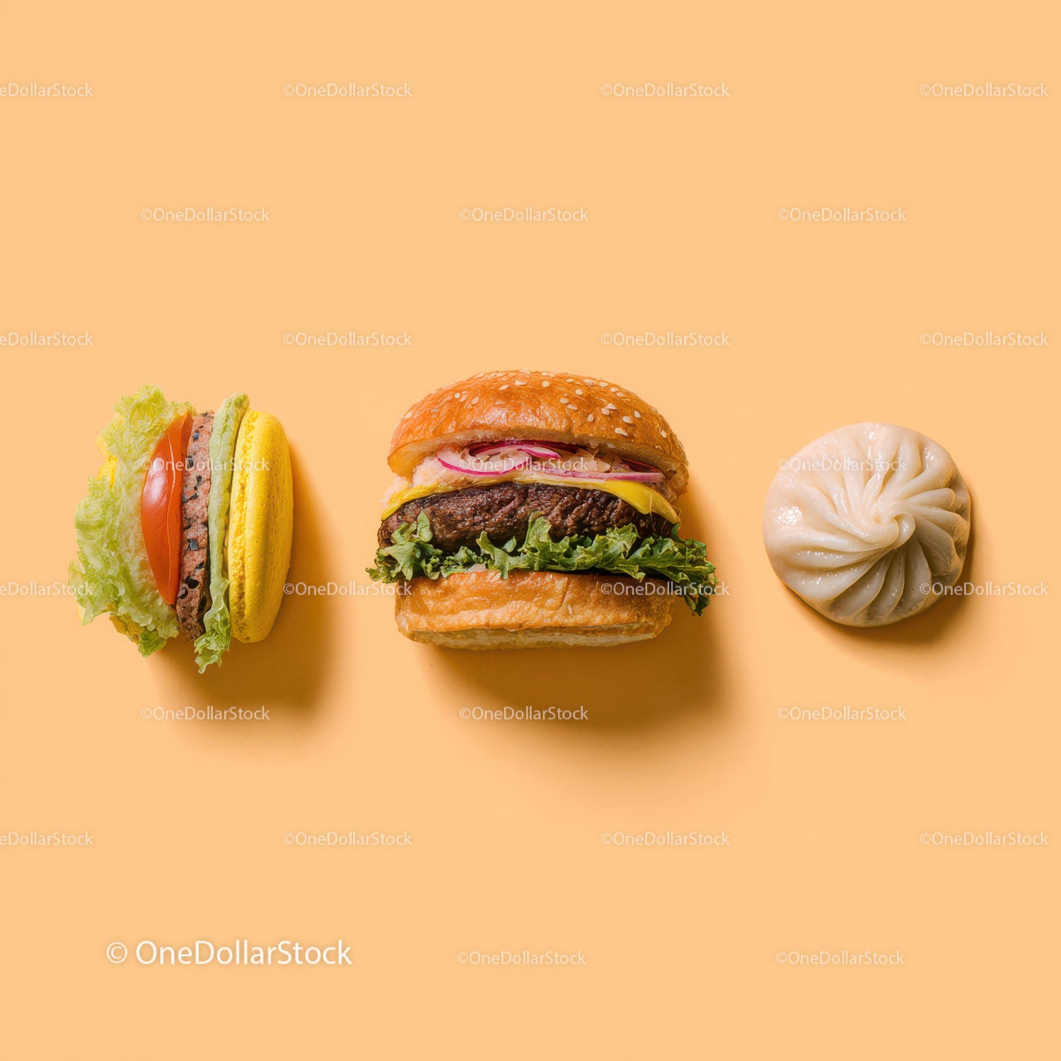 Gourmet Burger with Lettuce and Tomato Next to Grilled Steak and Dumpling