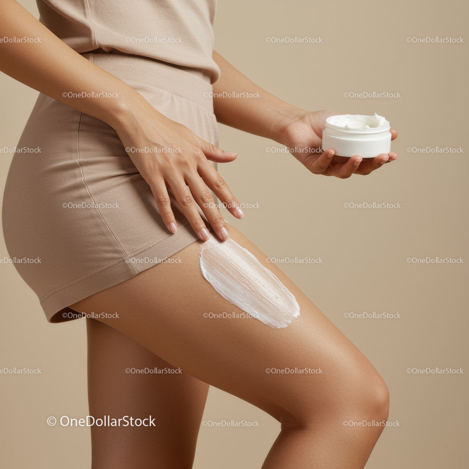 Woman Applying Lotion on Thigh During Skincare Routine