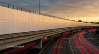 City Highway with Light Trails During Sunset in Urban Environment