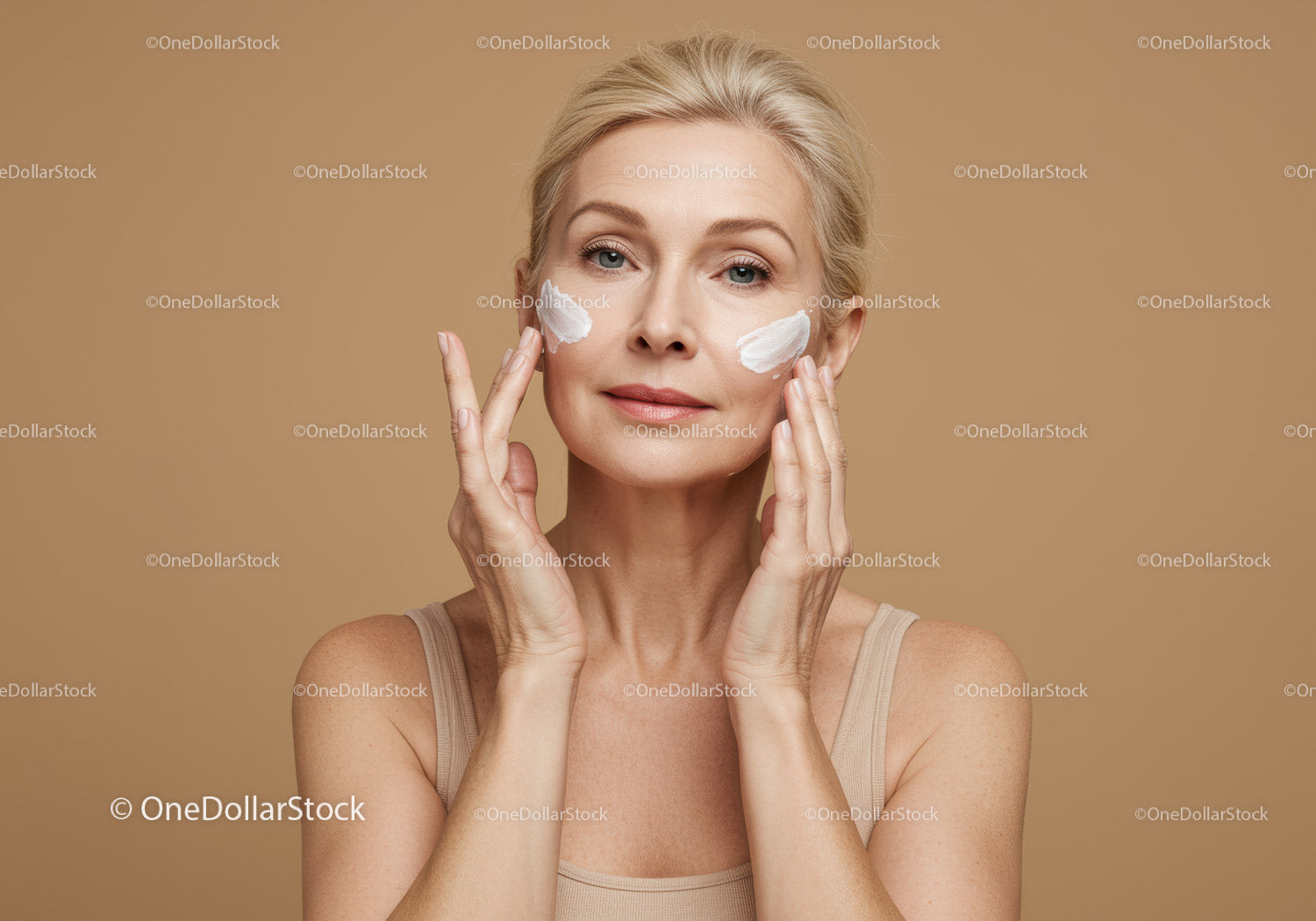 Mature Woman Applying Facial Cream for Skin Rejuvenation