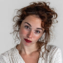 Close-Up of Young Woman with Red Curly Hair and Freckles