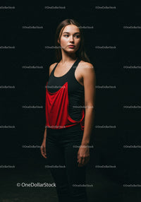 Thoughtful young woman standing against dark background