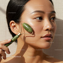 Elegant Woman Using Jade Roller for Skin Care Facial Treatment