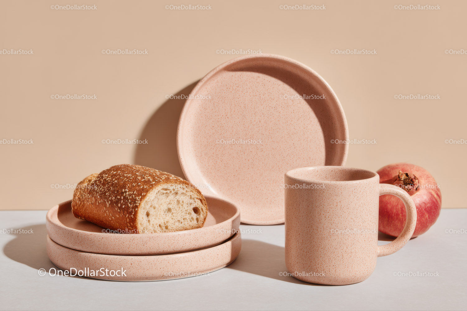 Set of Pink Ceramic Dishware with Bread and Peach for Breakfast