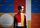 Fashion model in colorful geometric dress with retro hairstyle