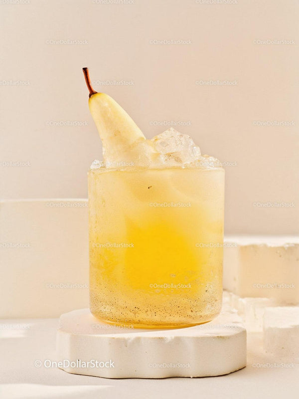 Chilled Pear Cocktail with Ice on White Pedestal