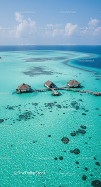 Overwater Bungalows Overlooking Blue Turquoise Lagoon Under Sunny Sky