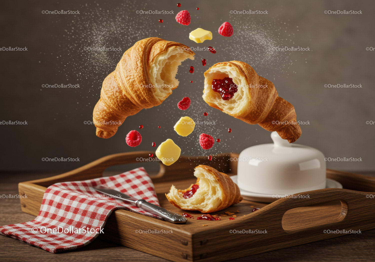 Fresh croissants with raspberry jam and butter on tray