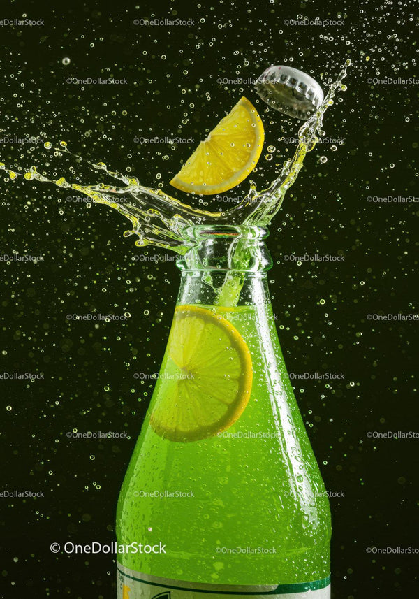 Refreshing lemon soda bottle with splash and cap flying