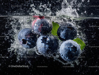 Fresh Blueberries Splashing in Water with Vibrant Dark Background