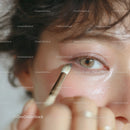 Close-up of Woman Applying Eyeshadow with Makeup Brush