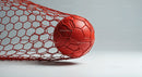 Red Soccer Ball in Goal Net with Dynamic Sports Atmosphere