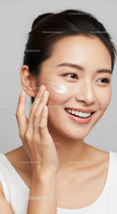 Young Woman Applying Face Cream for Glowing Skin