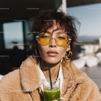 Fashionable Woman Wearing Yellow Sunglasses and Faux Fur Coat
