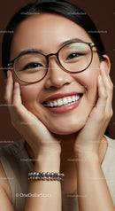 Happy woman with glasses smiling holding her face