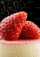 Fresh strawberries dusted with powdered sugar on dessert