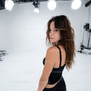 Portrait of a Young Woman with Wavy Hair in Studio